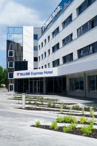 a building with a sign that reads taliminy express hospital at Tallink Express Hotel in Tallinn