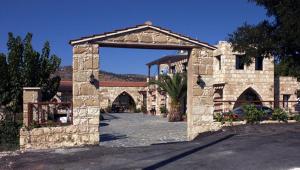 an entrance to a stone building with an archway at Studio with view in Polis area in Paphos