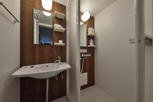 a bathroom with a sink and a mirror at Comfortable House In Fushimi 2 in Kyoto