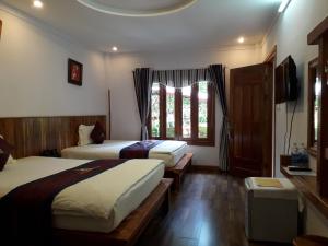 Giường trong phòng chung tại Phu Quoc Village