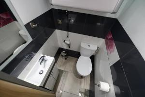 Koupelna v ubytování Apartament SYNERGIA + 15 fotografií