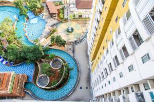 an aerial view of a swimming pool in a building at 2BR Apartment at 18th Floor Great Western By Travelio in Tangerang
