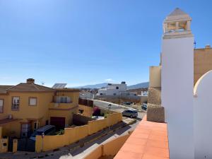 a lighthouse on the roof of a building at Casa Maldo in Tarifa