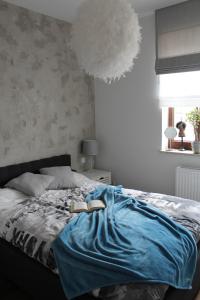 Ένα ή περισσότερα κρεβάτια σε δωμάτιο στο Apartament Wilanów Klimczaka