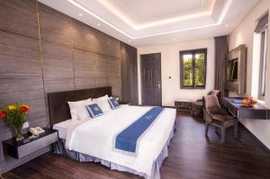 Postel nebo postele na pokoji v ubytování Beachfront Hotel