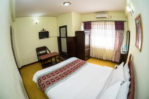 Kama o mga kama sa kuwarto sa Hotel Encounter Nepal & Spa