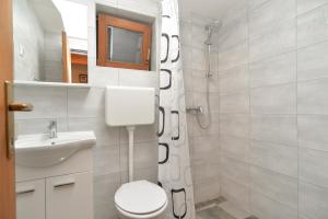 Koupelna v ubytování Apartment Mitar 1271 + 10 fotografií