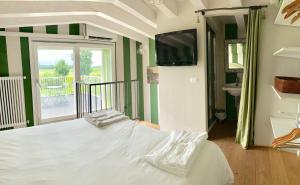 A bed or beds in a room at the green home