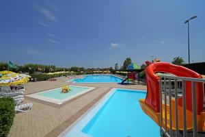 a pool with a slide and a water park at Residence Villaggio Tiglio in Sirmione