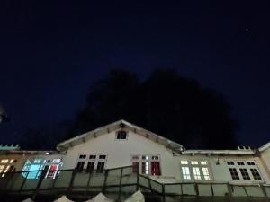 a white building at night with a dark sky at Hotel Madhuban Shimla in Shimla