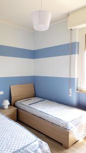 Apt. 7 - Villa dei Pini tesisinde bir odada yatak veya yataklar