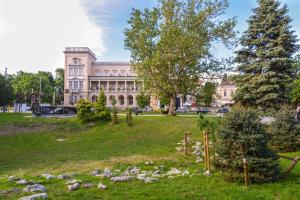 a park in front of a large building at CACAO Studio next to Crystal Garden and Russian Church in Sofia