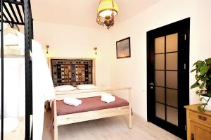 a bedroom with a bed and a wine cellar at Centre Apartment Old Tbilisi in Tbilisi City