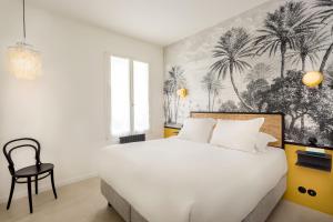 Postel nebo postele na pokoji v ubytování Montorgueil Suite