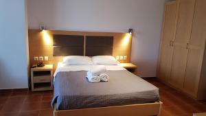Łóżko lub łóżka w pokoju w obiekcie Skiros Palace Hotel