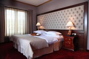 Postel nebo postele na pokoji v ubytování Simfonia Boutique Hotel