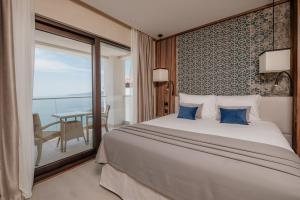 Ліжко або ліжка в номері ĀNANTI Resort, Residences & Beach Club - The Leading Hotels of the World