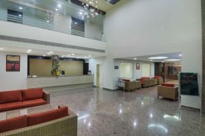 a lobby with couches and chairs in a hospital at GeeKay Millenniaa in Vellore