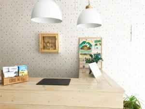 a room with a counter with two pendant lights at Hostal Beni in Benicàssim