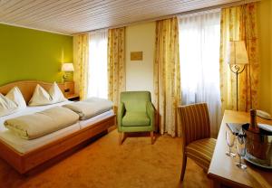 Letto o letti in una camera di Hotel La Cruna
