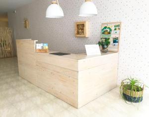 a wooden counter in a store with a counter top at Hostal Beni in Benicàssim