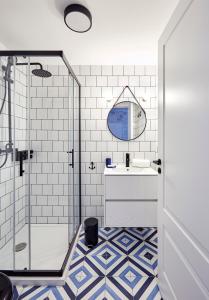 a bathroom with a shower and a sink at "Breeze" Aparthotel by Parrot`s House in Lloret de Mar