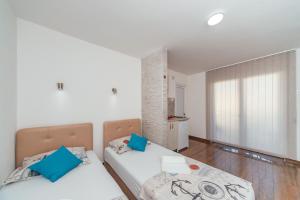 Postel nebo postele na pokoji v ubytování Apartmani Afterglow