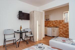Postel nebo postele na pokoji v ubytování Apartmani Afterglow