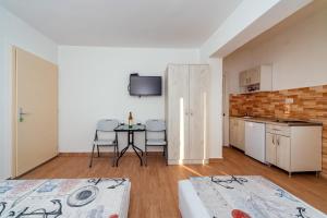 Kuchyň nebo kuchyňský kout v ubytování Apartmani Afterglow