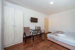 Postel nebo postele na pokoji v ubytování Apartmani Afterglow