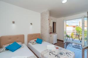 Postel nebo postele na pokoji v ubytování Apartmani Afterglow