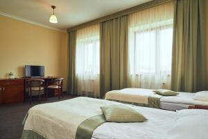 Postel nebo postele na pokoji v ubytování Hotel Patriarshyi + 25 fotografií