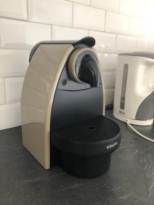 a printer sitting on a counter next to a toaster at Amazing Studio Cannes Center in Cannes