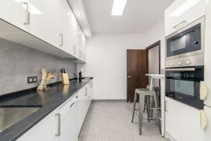 Kuchyňa alebo kuchynka v ubytovaní Puerto - Local Rentss