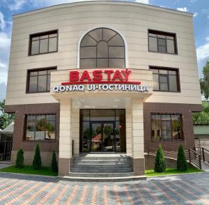a building with a sign for a casino at Bastau Hotel in Almaty