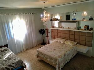 Postel nebo postele na pokoji v ubytování Chácara reis