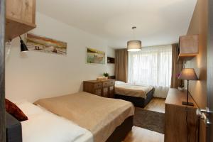 Postel nebo postele na pokoji v ubytování Apartmany Arber + 37 fotografií