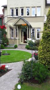 a house with a garden in front of it at Villa Freven in Pärnu