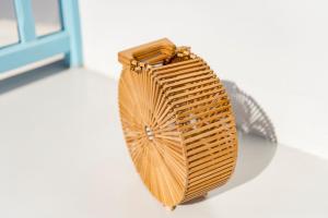 a wicker bag sitting on the floor in a room at Mykonian Mews Luxury Suites in Psarou