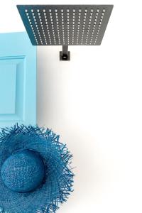 a blue basket with a blue ball in a room at Mykonian Mews Luxury Suites in Psarou