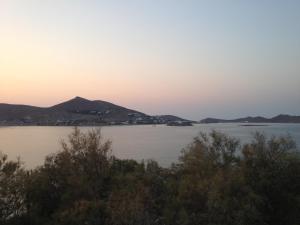 a view of a large body of water at sunset at Hippocampus Hotel in Naousa