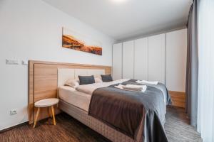 Postel nebo postele na pokoji v ubytování Apartmány pri vstupe do Aquaparku