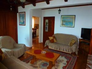 a living room with two couches and a coffee table at Apartment Djakonovic Mladen in Ulcinj