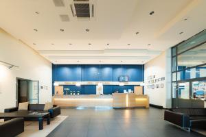 a lobby of a building with blue walls at Park Hotel Latgola in Daugavpils