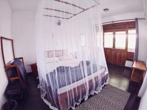 Postel nebo postele na pokoji v ubytování Lakshmis Hotel Ella