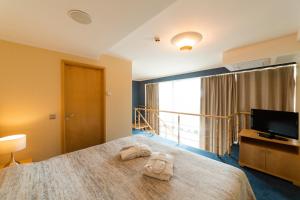 Кровать или кровати в номере Park Hotel Latgola