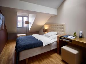 Posteľ alebo postele v izbe v ubytovaní The ICON Hotel & Lounge