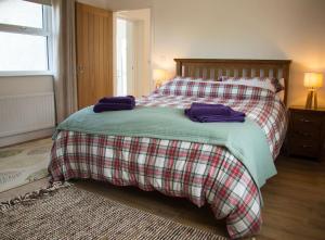 Säng eller sängar i ett rum på Bramble Cottage