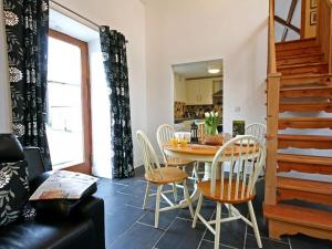 a dining room with a table and chairs at Hendre in Llanllyfni