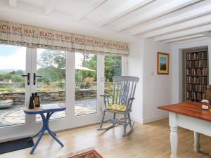 a room with a desk and a chair and a window at Big House in Llandecwyn